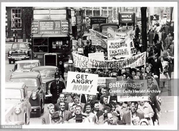 Marchers jam London's streets on their protest 4th June 1962. Lancashire cotton workers marched through London today to protest against foreign...