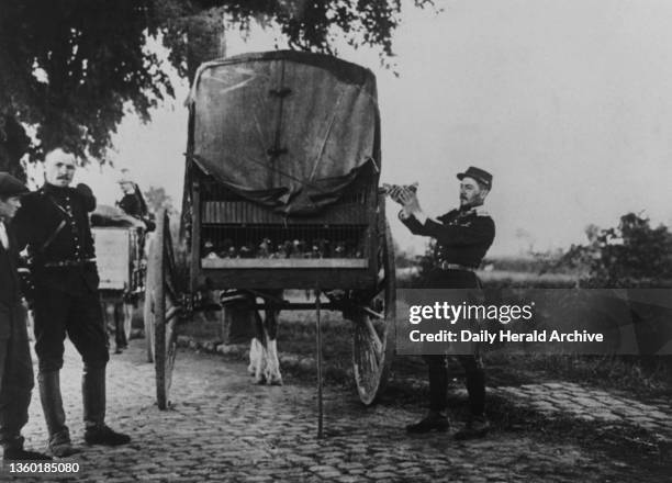 French army in Belgium with a van of carrier pigeons, used to send messages back to headquarters. Photograph was republished in 1940 as the Nazis...