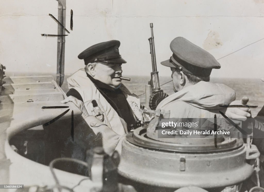 Prime Minister Winston Churchill chats with General Sir Alan Brooke, on the bridge of a warship