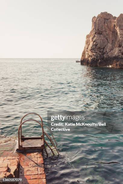 girl swimming at lido del faro, capri - isle of capri stock pictures, royalty-free photos & images