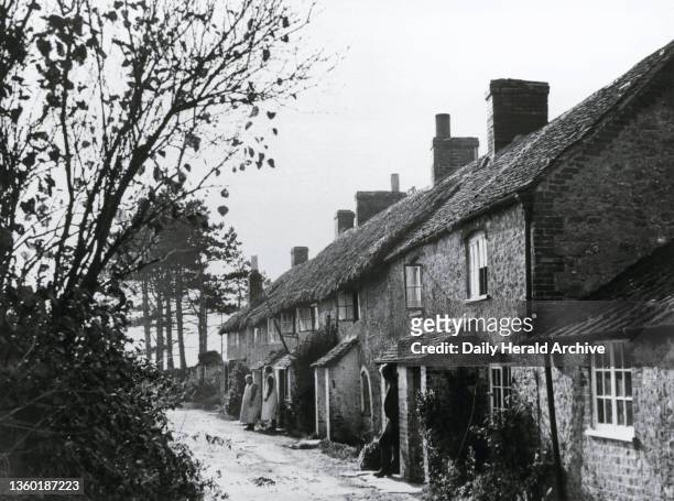 Smugglers cottages at Fleet, near Weymouth in Dorset, 4 November 1937. 'Under the slum clearance scheme, these six old smugglers' cottages at Fleet,...