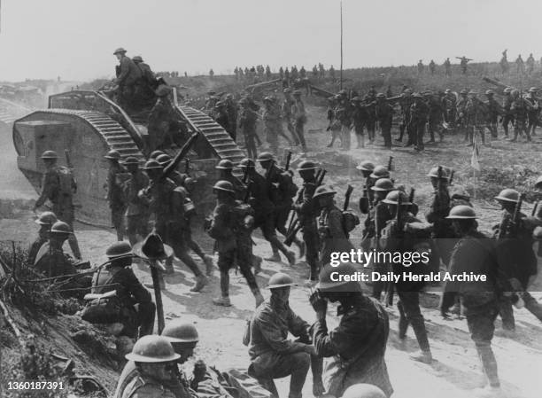 Soldiers and an early tank, Western Front, WWI.