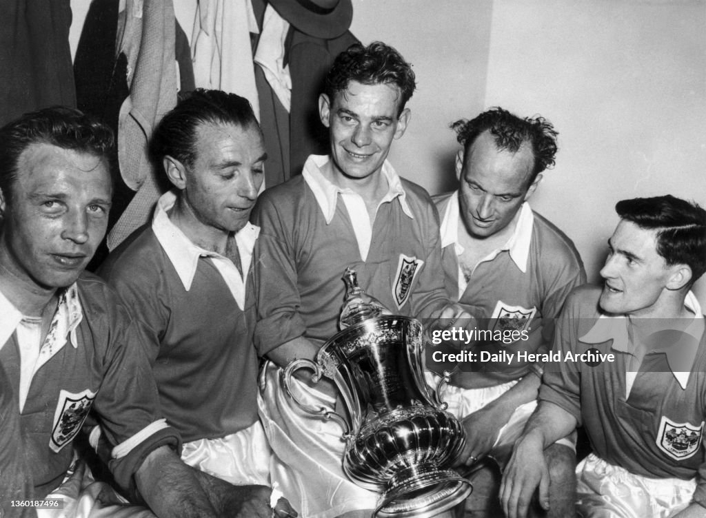 Stanley Matthews (1915-) and team mates holding the FA Cup, 2 May 1953