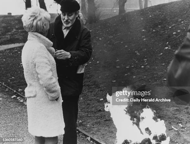 Spike Milligan burning a rare and valuable ocelot fur coat in an endeavour to draw attention to the continuous drain on rare animals simply because...