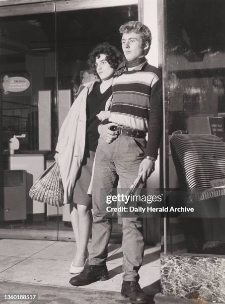 Colhette Burtoun and Ralph Day seen sheltering from the rain in Bracknell. Teenagers in Bracknell, 19 October 1959. Terry Fincher began his career as...
