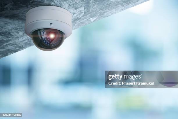 ccty on ceiling in modern building - security equipment stock pictures, royalty-free photos & images