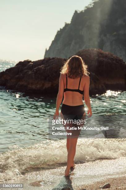 Girl swimming at Marina Piccola Beach on Capri