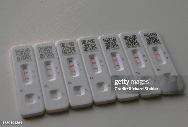 In this photo illustration, a series of positive Covid-19 test results are displayed on December 21, 2021 in London, England. Covid-19...