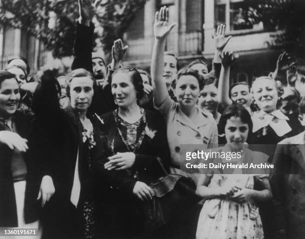 Women and girls giving the Fascist salute as they acclaimed the victorious Nationalist forces in Bilbao, during the Spanish Civil War, June 21st, 1937