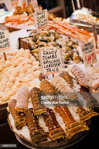 seafood for sale sitting on ice - pike place market stock pictures, royalty-free photos & images