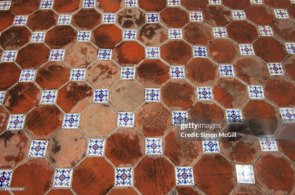Traditional Spanish colonial octagon Mexican Saltillo tile floor with square glazed painted tile inserts