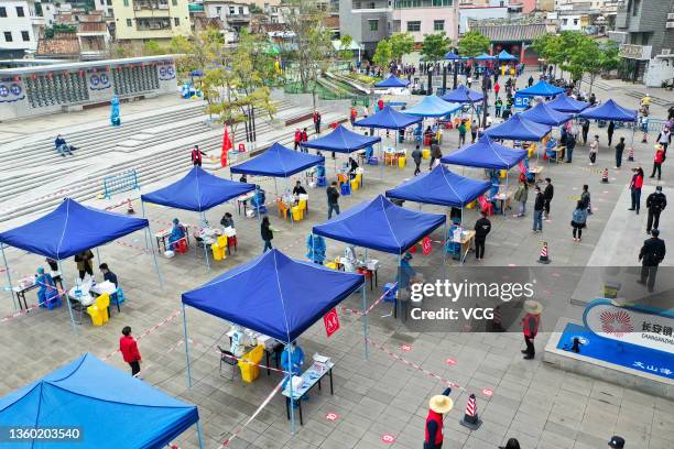 Aerial view of people queuing up for COVID-19 nucleic acid testing on December 20, 2021 in Dongguan, Guangdong Province of China.