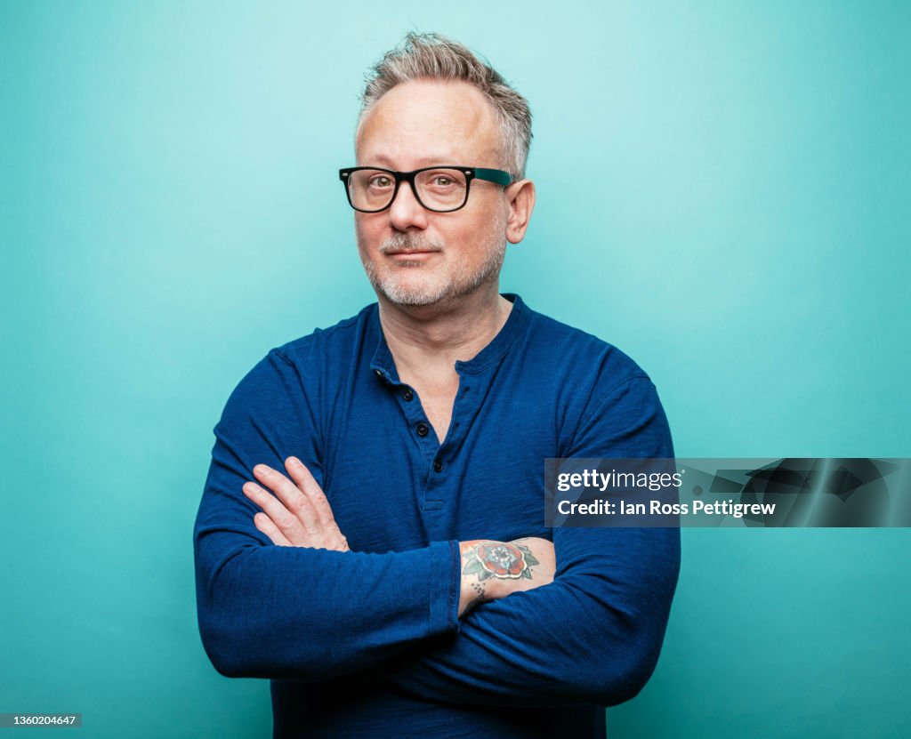Tattooed Hipster with arms crossed