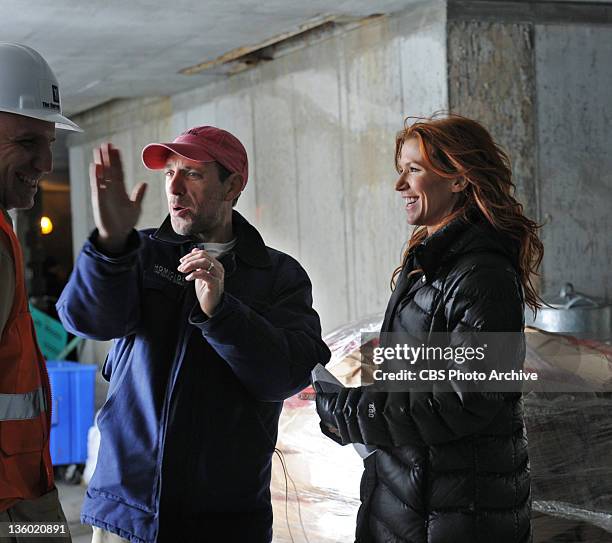 Butterfly Effect" -- Poppy Montgomery discusses a scene with director Jace Alexander on the set of UNFORGETTABLE, Tuesday, Jan 3 on the CBS...