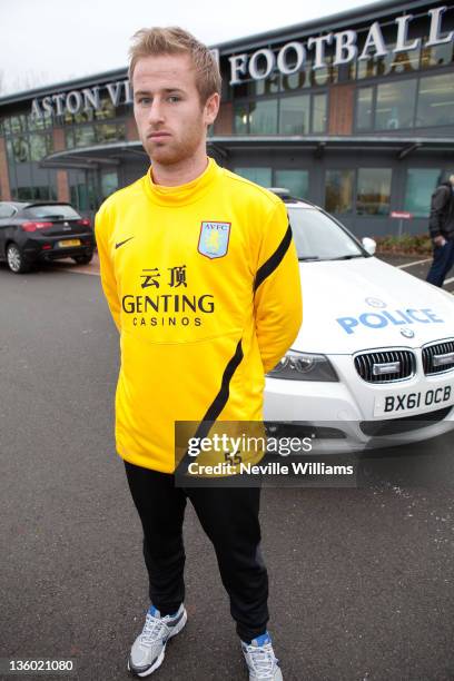 Barry Bannan of Aston Villa and Inspector Greg Jennings of the West Midlands Police attend a photo shoot for the West Midlands Police Don't Drink And...