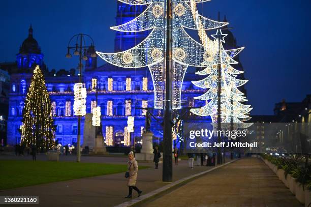 Members of the public view the lights in George Square as Covid rules are tightened on December 21, 2021 in Glasgow, Scotland. First Minister Nicola...