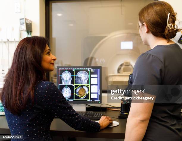 reviewing fmri results - nurse thinking stock pictures, royalty-free photos & images