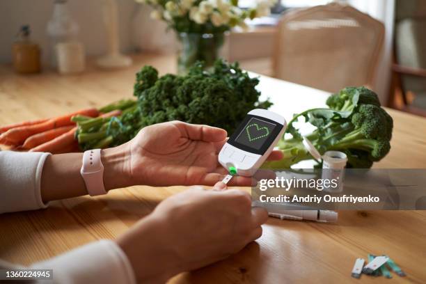 blood glucose test at home. - diabetes pictures stock pictures, royalty-free photos & images