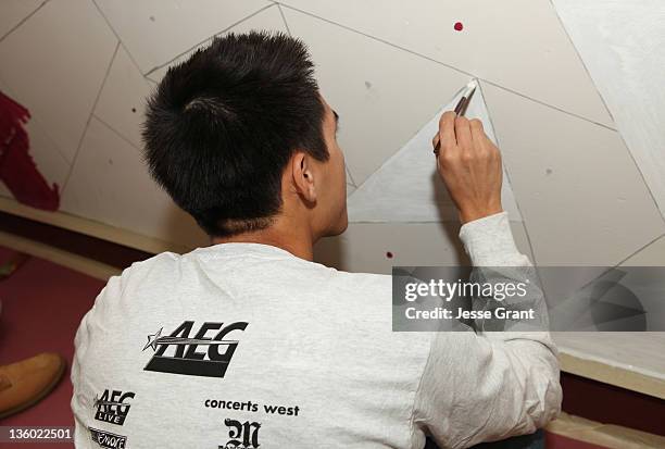 Volunteer attends AEG's Season of Giving Service Day at John Muir Middle School with City Year Los Angeles and LA's Promise on December 16, 2011 in...