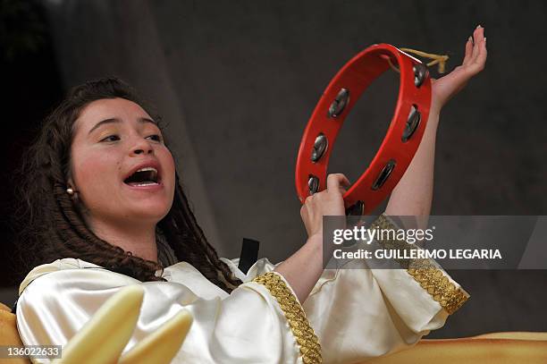 Girl prays the Christmas Novena while recreating a living Nativity scene on December 16 at the Chorro de Quevedo Square in the neighborhood of La...