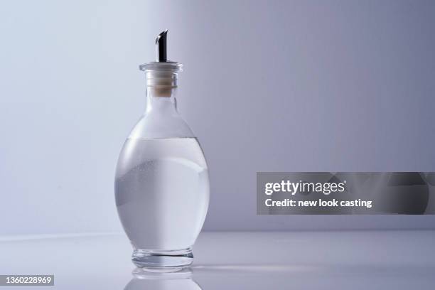 white vinegar against white background - white vinegar stock pictures, royalty-free photos & images