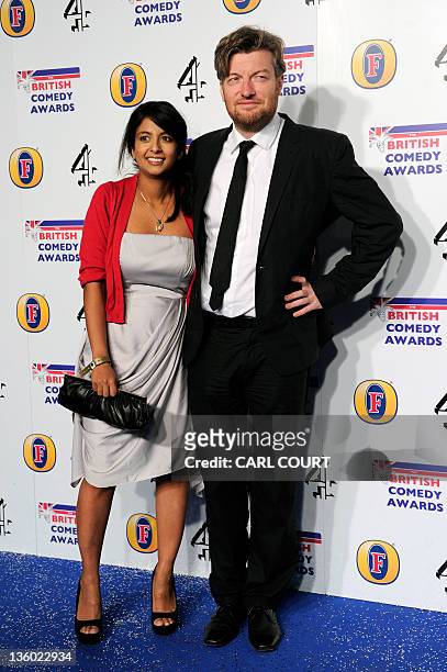British journalist, comic writer and broadcaster, Charlie Brooker, and his wife, television presenter Konnie Huq, pose at the British Comedy Awards...