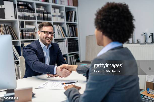 handshake between two business people for reaching a new agreement - initiative stock pictures, royalty-free photos & images