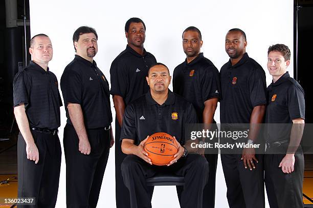Coaches Michael Malone, Jerry DeGregorio, Pete Myers, Mark Jackson, Wes Unseld Jr., Kris Weems and Darren Erman of the Golden State Warriors poses...