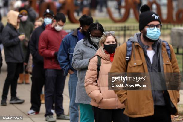 Local residents wait in line for COVID-19 tests at a free testing site at Farragut Square as coronavirus cases surge in the city on December 21, 2021...