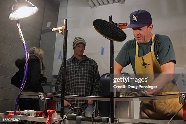 Wax technician Curtis Bacca prepares snowboards for Seth Wescott in the waxroom on the eve of the LG Snowboard-Cross FIS World Cup on December 16,...