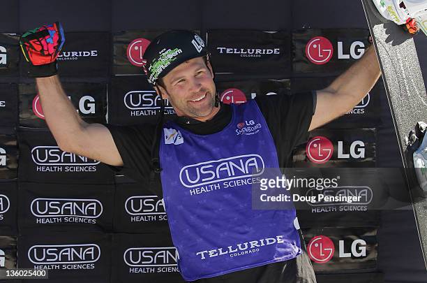 Nick Baumgartner celebrates on the podium after he finished third in the men's LG Snowboard-Cross FIS World Cup on December 16, 2011 in Telluride,...