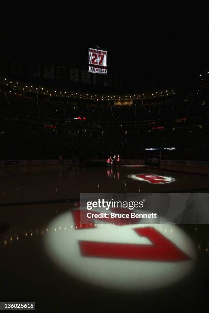 Scott Niedermayer has his jersey lifted to the rafters during his retirement ceremony hosted by the New Jersey Devils prior to the game against the...