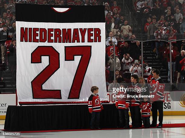 Scott Niedermayer takes part in his jersey retirement ceremony by the New Jersey Devils prior to the game against the Dallas Stars at the Prudential...