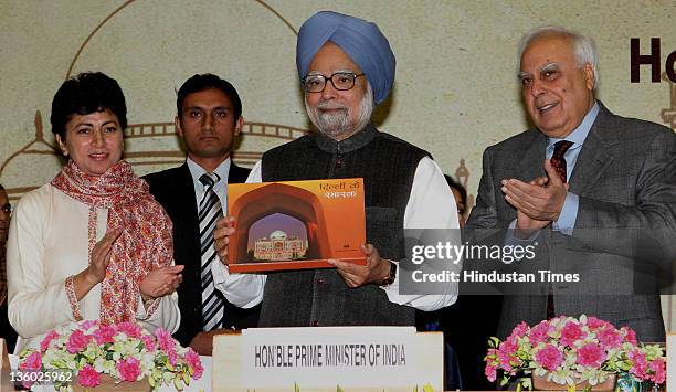 Prime Minister Manmohan Singh released a book "Dilli ke Smarak" in the presence of Comunication and IT Minister Kapil Sibal and Culture Minister...