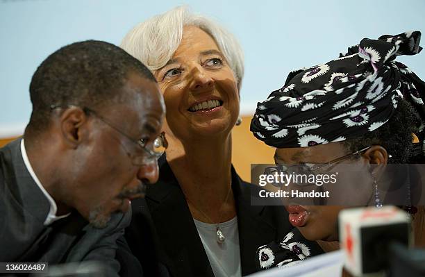 In this handout image provided by the International Monetary Fund , International Monetary Fund's Managing Director Christine Lagarde sits between...