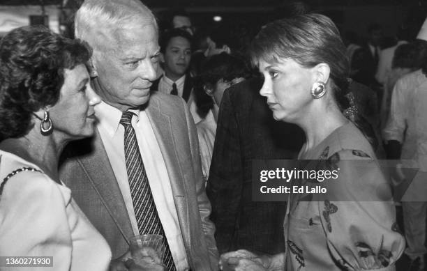 American broadcast journalist Jane Pauley speaks with an unidentified couple during the 1988 Republican National Convention, New Orleans, Louisiana,...