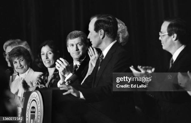 As married couple Marilyn Quayle and American politician Dan Quayle and others applaud, American politician George HW Bush accepts his party's...