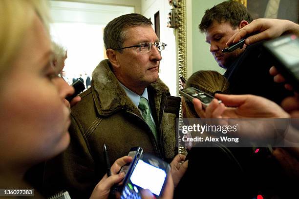 Sen. Kent Conrad is surrounded by members of the media after he met with fellow Senate Democrats on a deal on payroll tax cut that has been struck...