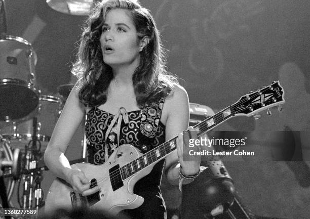 American rock musician and songwriter Vicki Peterson, of the American pop rock band The Bangles, plays on stage during the "Be With You" video circa...