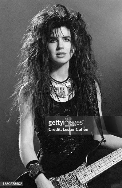 American bassist, guitarist, songwriter, and singer Michael Steele, of the American pop rock band The Bangles, plays on stage during the "Be With...