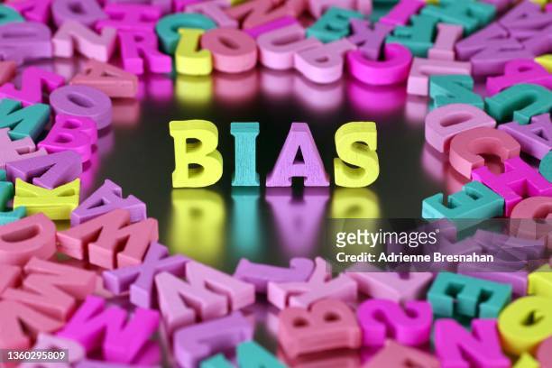 colorful craft letters spelling “bias” - bias stock-fotos und bilder