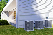 Exterior Of Villa With Air Heat Pumps In The Backyard