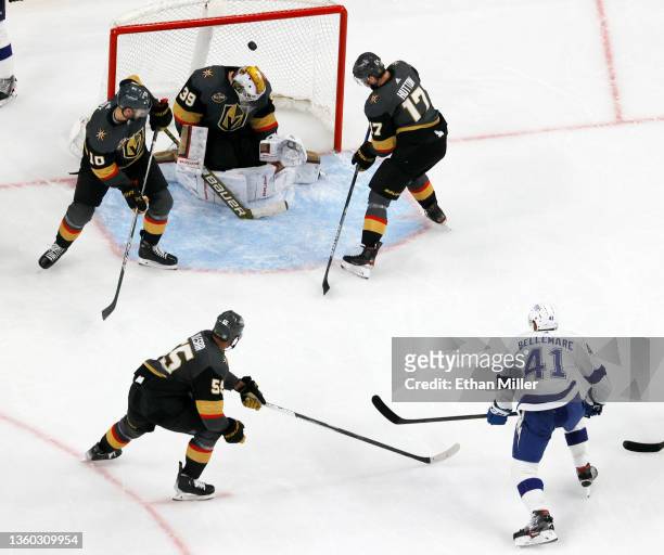 Pierre-Edouard Bellemare of the Tampa Bay Lightning scores a second-period goal against Laurent Brossoit of the Vegas Golden Knights as Keegan...