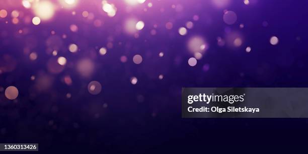 gold defocused lights on purple background - sparkle background stock pictures, royalty-free photos & images