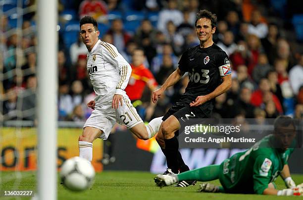 Jose Callejon of Real Madrid scores Real's opening goal past goalkeeper Orlando Quintana of Ponferradina, during the round of last 16 Copa del Rey...