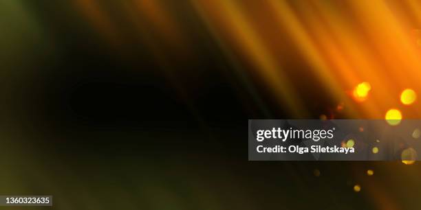 film flare with defocused light - gold lens flare stock pictures, royalty-free photos & images
