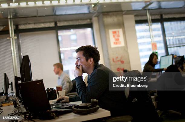 Facebook Inc. Employees work at their desks at the company's office in New York, U.S., on Tuesday, Dec. 20, 2011. "Cool spaces" will spread to U.S....