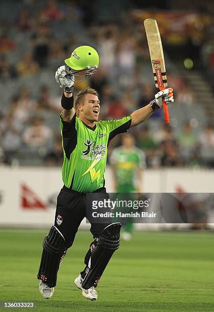 David Warner of the Thunder reaches his century during the T20 Big Bash League match between the Melbourne Stars and the Sydney Thunder at Melbourne...