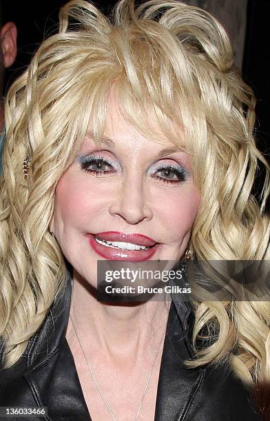 Dolly Parton poses backstage at the musical "Bonnie and Clyde" on Broadway at The Gerald Schoenfeld Theatre on December 16, 2011 in New York City.