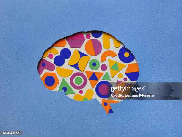 paper brain silhouette with geometric shapes - thoughts stock-fotos und bilder